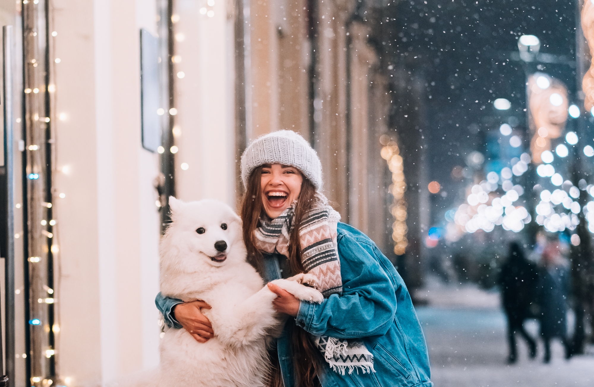 woman-is-hugging-her-dog-night-street