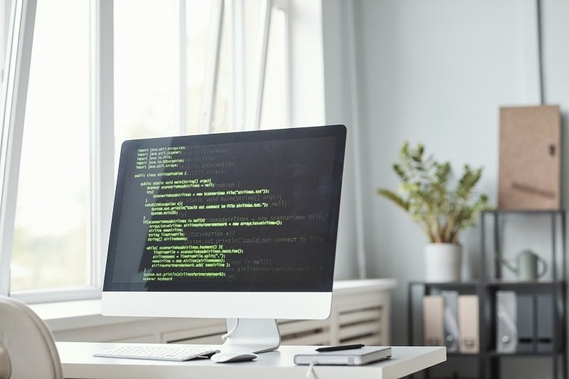 computer-with-code-in-office