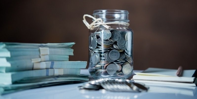 bottles-of-cash-with-coins-in-saving-money-concept